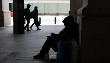 Commuters make their way though snow and ice in the aftermath of a winter storm in Washington