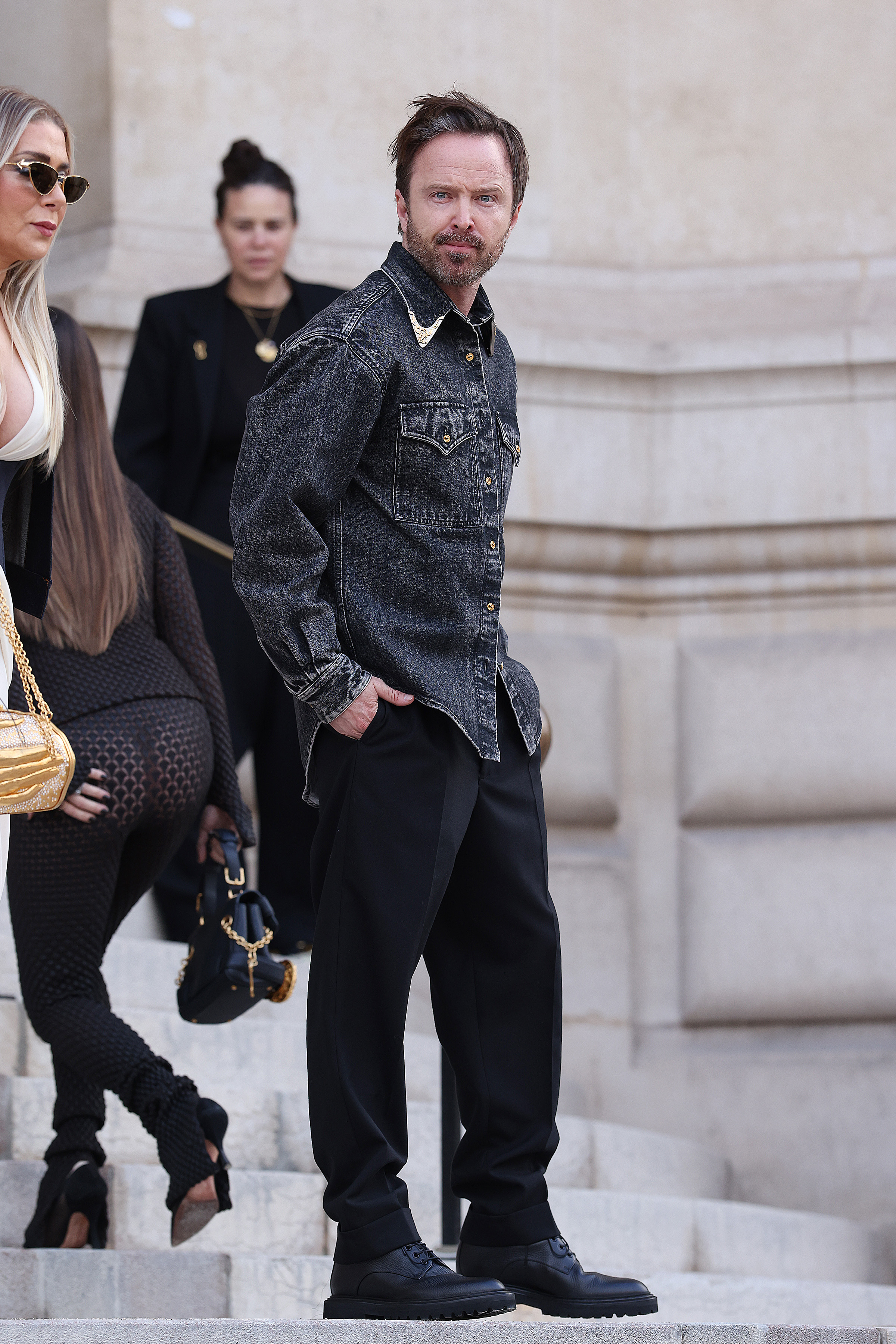Aaron Paul attends the Schiaparelli Haute Couture show during Paris Fashion Week.