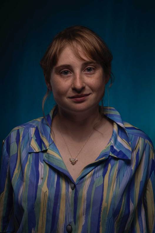 A woman wearing a striped shirt.