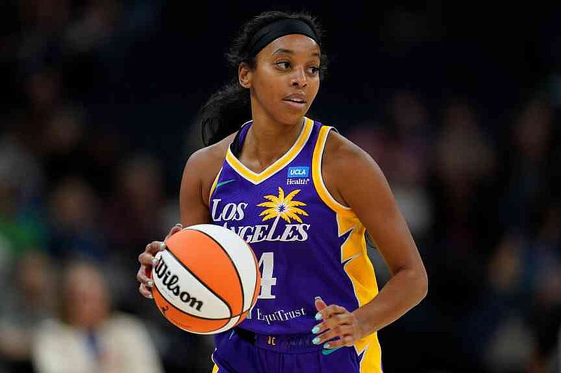 FILE - Los Angeles Sparks guard Lexie Brown dribbles down the court during the first half of a WNBA basketball game against the Minnesota Lynx  June 11, 2023, in Minneapolis. (AP Photo/Abbie Parr. File)