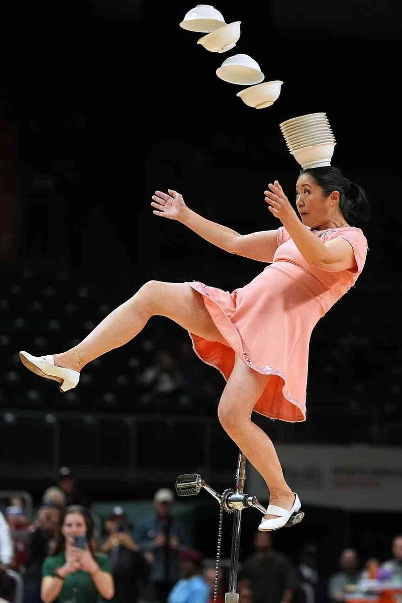 Red Panda performs during halftime of an NCAA college basketball game between Miami and Stanford in Coral Gables, Fla.,  Wednesday, Jan. 28, 2026. (AP Photo/Rebecca Blackwell)