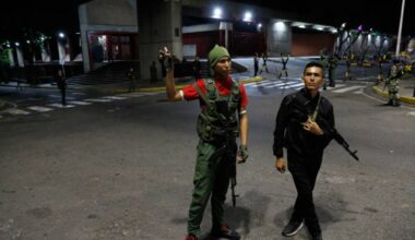 Members of the presidential guard stand outside the Miraflores presidential palace after explos ...
