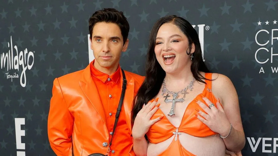 "Hacks" co-stars Paul W. Downs and Megan Stalter made a tongue-in-cheek nod to Timothée Chalamet and Kylie Jenner's matching all-orange looks at last month's "Marty Supreme" premiere. - Mike Blake/Reuters