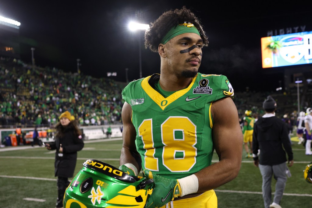 Kenyon Sadiq #18 of the Oregon Ducks celebrates after defeating the James Madison Dukes during the 2025 College Football Playoff First Round Game at Autzen Stadium on December 20, 2025 in Eugene, Oregon.