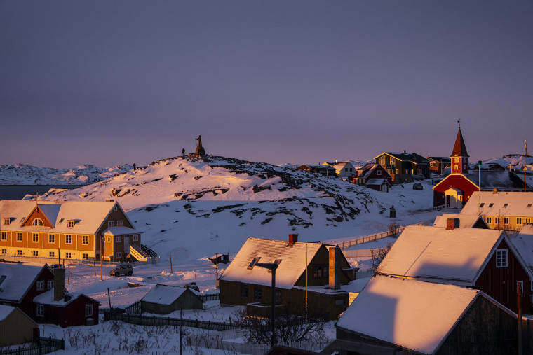 A statue of Hans Egede, a Dano-Norwegian Lutheran missionary, overlooks buildings in Nuuk, Greenland on Wednesday. 