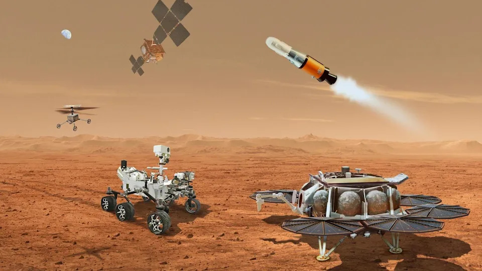  A rendering of multiple rovers, drones, sample caches, and spacecraft around the surface of Mars. 