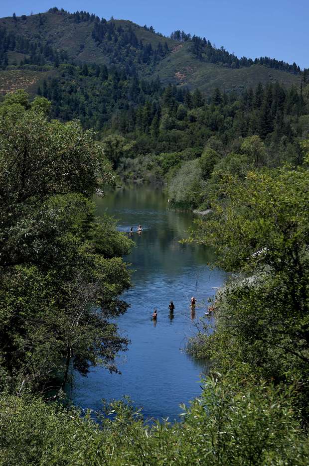 The Eel River east of Potter Valley is summertime slow and lazy creating a spot for day use with water backed up by the Van Arsdale Reservoir at the Cape Horn Dam, Friday, June 7, 2024. (Kent Porter / The Press Democrat) 2024