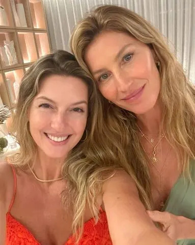 Gisele Bundchen/Instagram  Gisele Bündchen wearing her initial necklace in a selfie with her sister Patricia