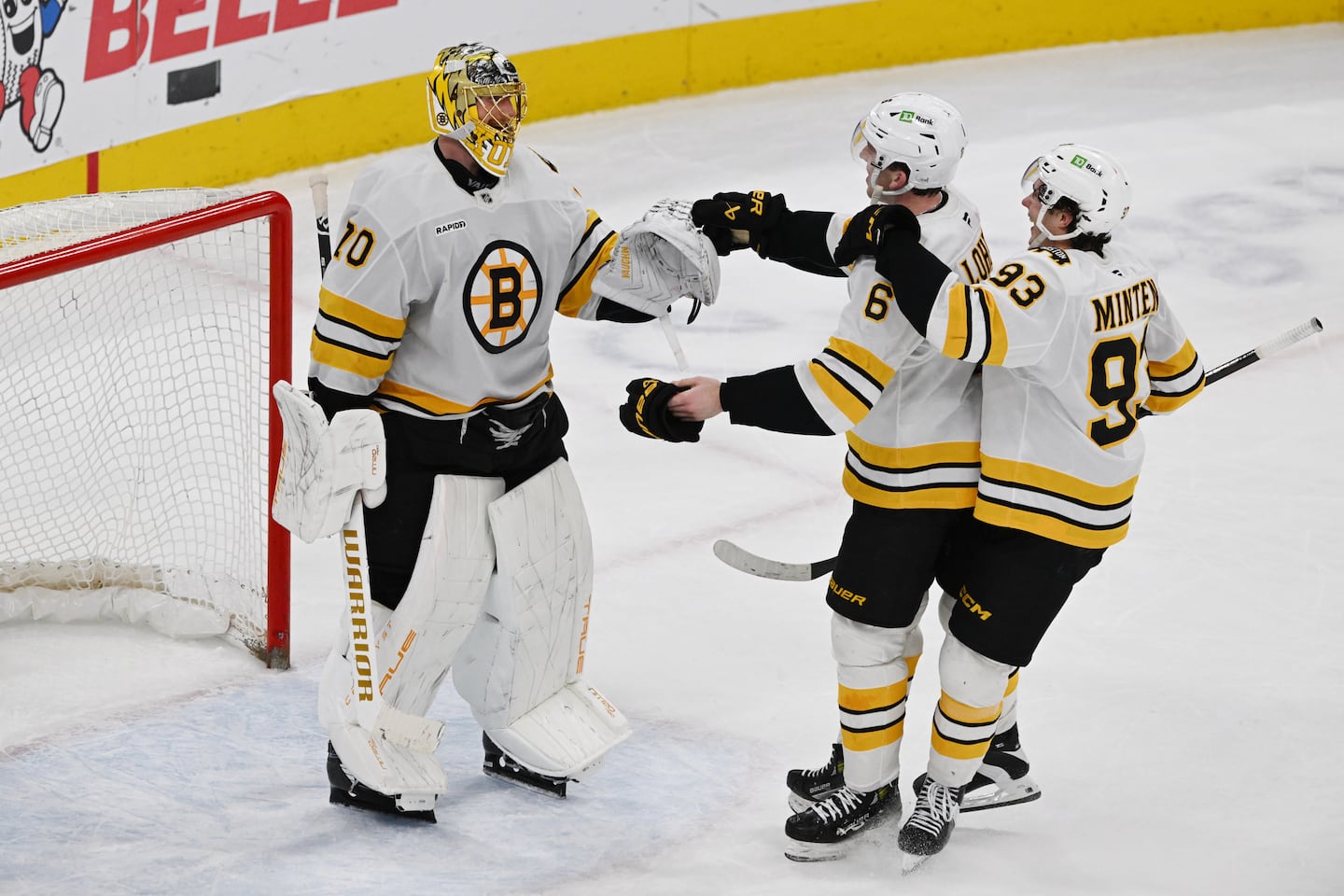 Bruins defenseman Mason Lohrei (6) scored a pair of goals in Saturday night's victory over the Blackhawks, and was the first to congratulate goalie Joonas Korpisalo on notching the win.