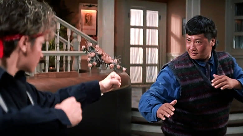 Cynthia Rothrock as a bandit and Sammo Hung as Ching, about to fight in Millionaire's Express