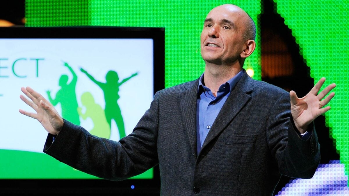 Peter Molyneux stands on stage at an Xbox show.