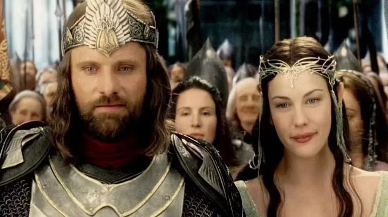 Aragorn and Arwen with a crowd at the end of The Return of the King