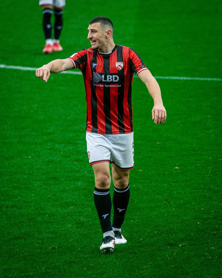 Maldini Kacurri with Morecambe FC (Photo via Morecambe FC on Instagram)