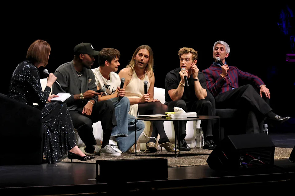 The Queer Eye cast sits on stage in conversation