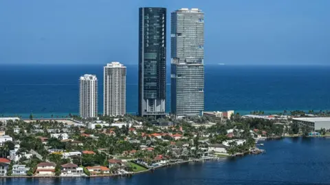 AFP via Getty Images The Porsche Design Tower in Miami, black, centre, opened in 2017