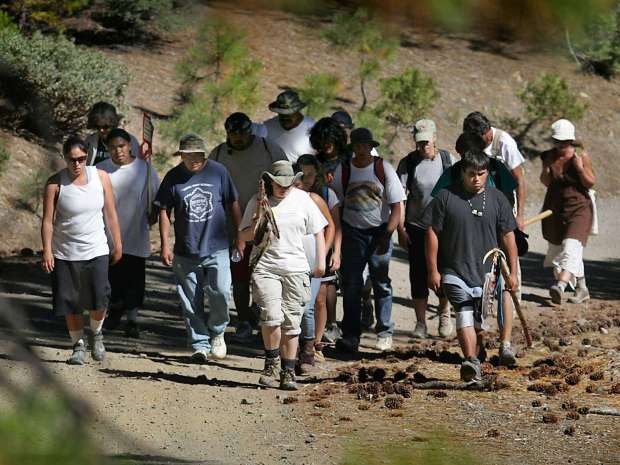 Walking towards their camp to Wells Cabin, native Americans participate in the 15th annual 100-mile Nome Cult Trail, Thursday Sept. 16, 2010 near Anthony Peak in the Mendocino National Forest. Nome Cult is a walk that traces the forced relocation of Indians from Chico across what is now the Mendocino National Forest to Round Valley in 1863. The walk started near Orland in the Sacramento Valley on Monday, and will end with a celebration in Covelo on Saturday. (Kent Porter / Press Democrat) 2010