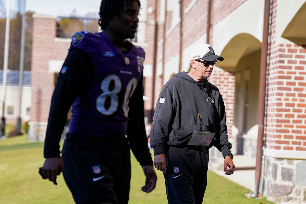 Baltimore Ravens tight end Isaiah Likely (80) and Offensive Coordinator Todd Monken head inside The Castle following a team practice at the Under Armour Performance Center in Owings Mills, Maryland on Thursday, October 31, 2024.