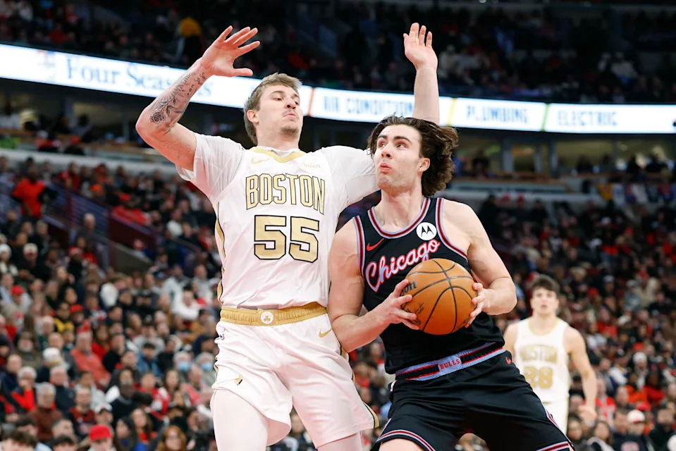 Jan 24, 2026; Chicago, Illinois, USA; Chicago Bulls guard Josh Giddey (3)drives to the basket against Boston Celtics guard Baylor Scheierman (55)during the first half at United Center. Mandatory Credit: Kamil Krzaczynski-Imagn Images