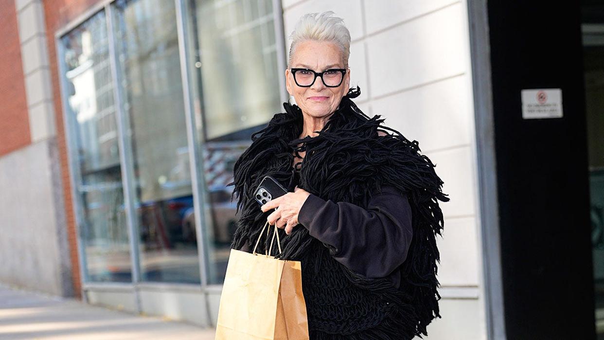 Susan Powter on the streets of New York in a black coast this November