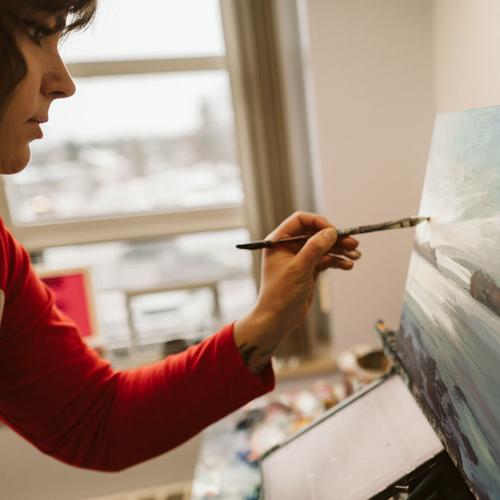 Rachel Christopoulos working on a painting