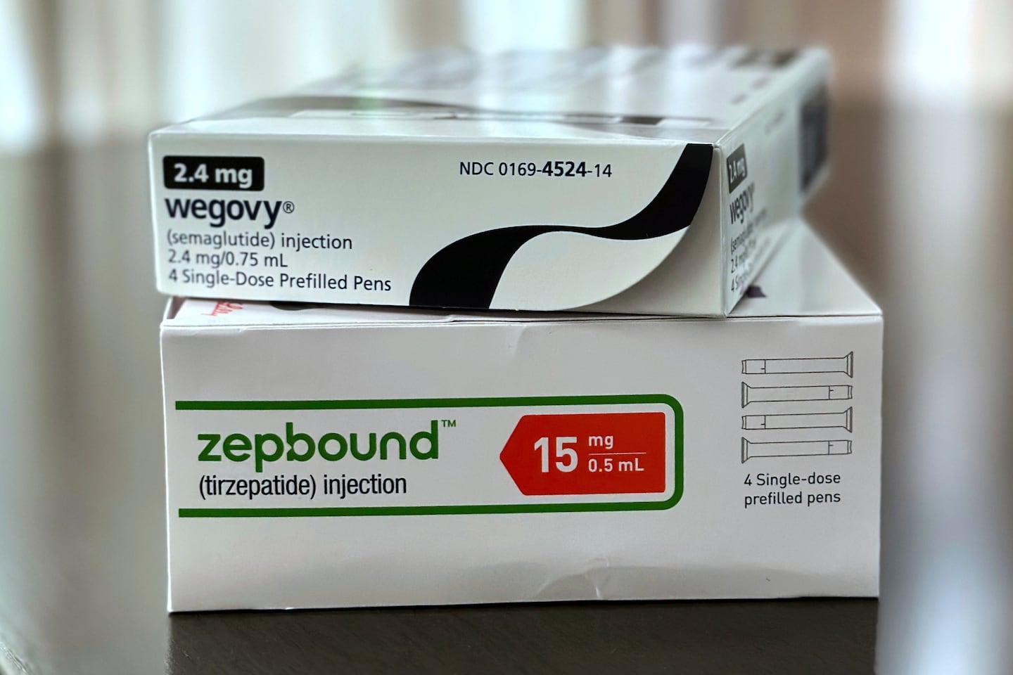 Boxes for the medications Wegovy and Zepbound are arranged for a photograph in California on May 8, 2025.