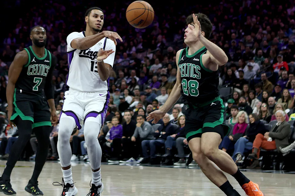 Jan 1, 2026; Sacramento, California, USA; Sacramento Kings forward Keegan Murray (13) passes the ball against the Boston Celtics during the third quarter at Golden 1 Center. Mandatory Credit: Dennis Lee-Imagn Images