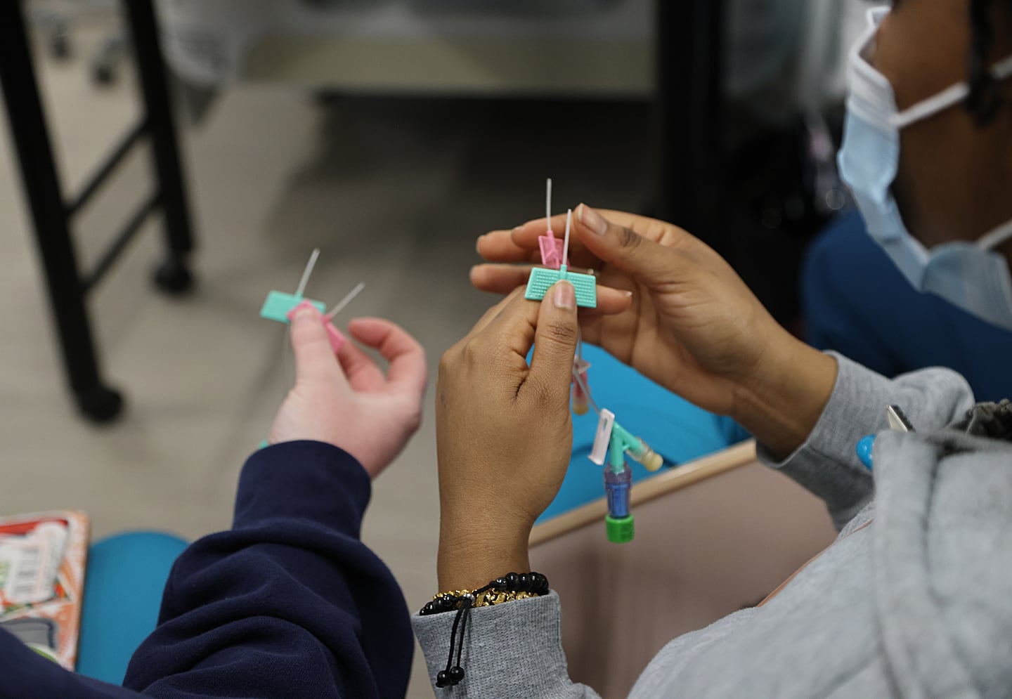 Nursing students at the MGH Institute handled equipment in class.   