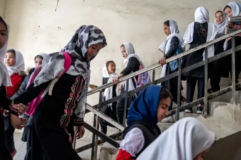 AP Girls attend school on the first day of the new school year, in Kabul, Afghanistan, on March 25, 2023. (AP Photo/Ebrahim Noroozi, File)