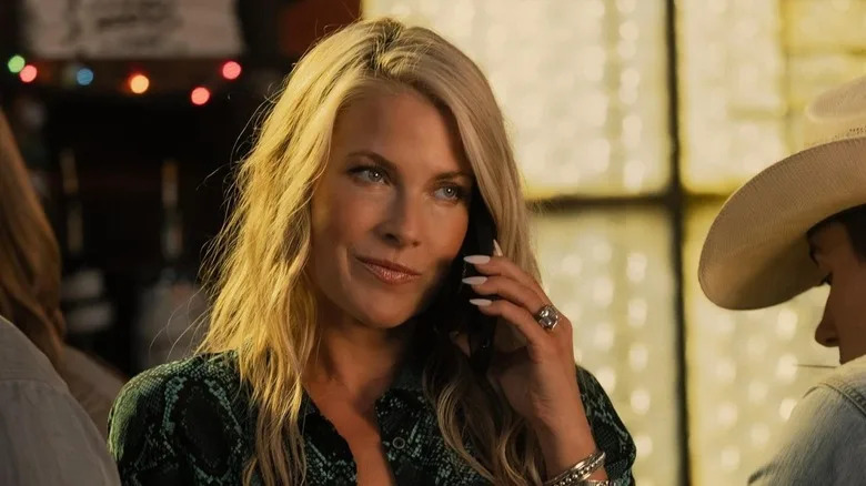 Angela holding a phone on "Landman"