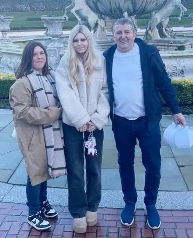 Michelle and Mark Sneddon with their daughter Isla. SWNS