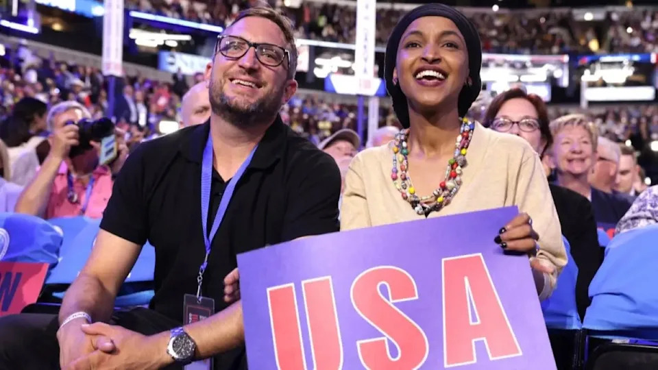 Ilhan Omar sits with husband Tim Mynett