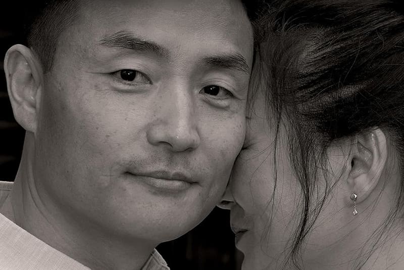 A close, intimate black-and-white portrait reflects love, commitment, and human connection—recurring themes in Meridian’s most-read stories.