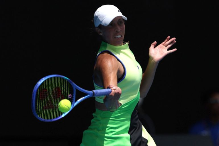 USA's Madison Keys hits a return to Ukraines Oleksandra Oliynkova during their women's singles match on day three of the Australian Open tennis tournament in Melbourne on January 20, 2026. (Photo by Martin KEEP / AFP) / -- IMAGE RESTRICTED TO EDITORIAL USE - STRICTLY NO COMMERCIAL USE --