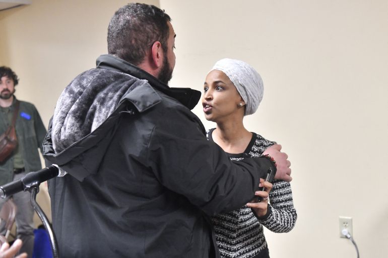 US Representative Ilhan Omar (D-MN) (R) reacts after being sprayed with an unknown substance by a man as she hosted a town hall in Minneapolis, Minnesota, on January 27, 2026. (Photo by Octavio JONES / AFP)