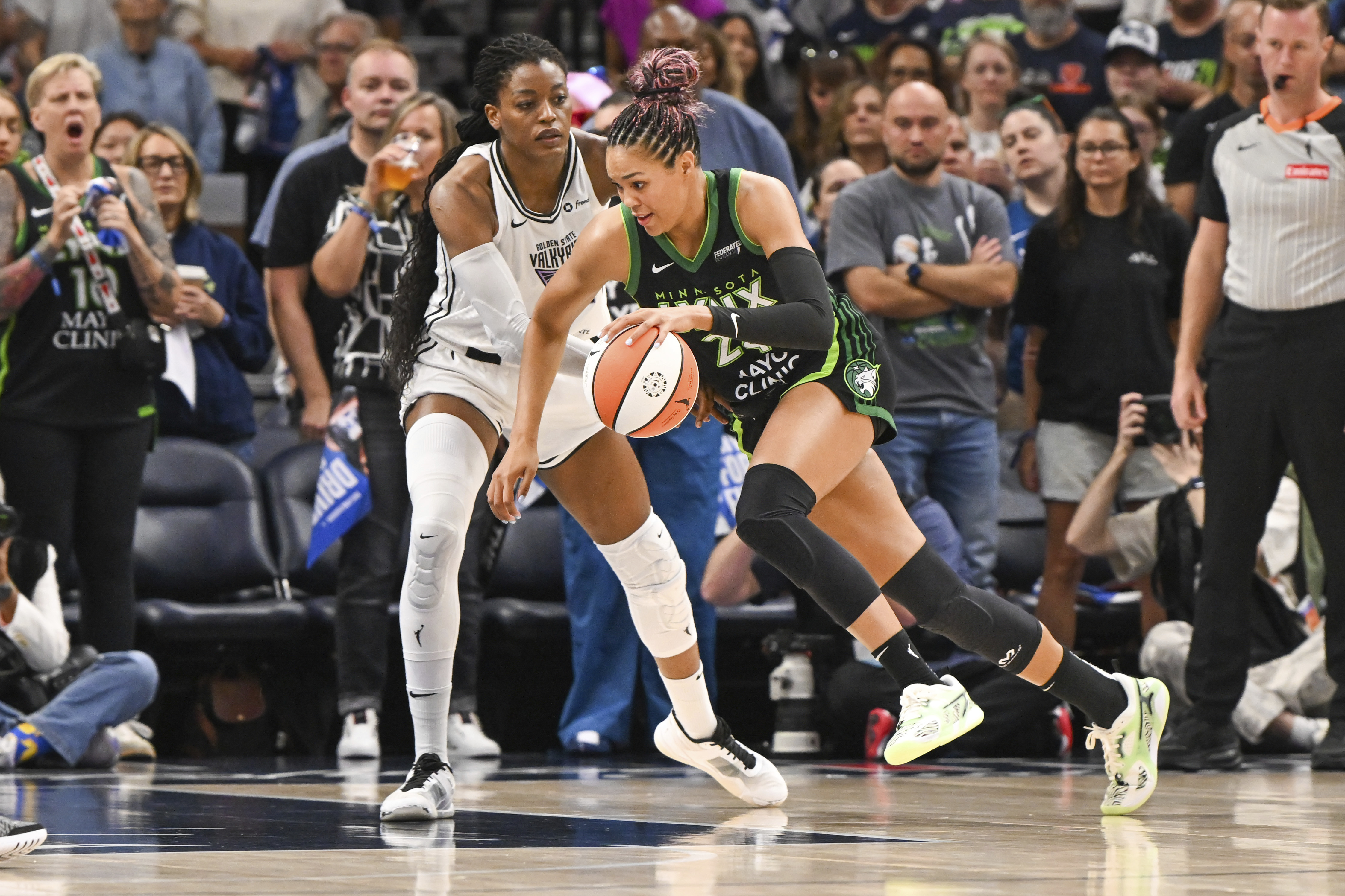 Minnesota Lynx forward Napheesa Collier, right, drives past Golden State...