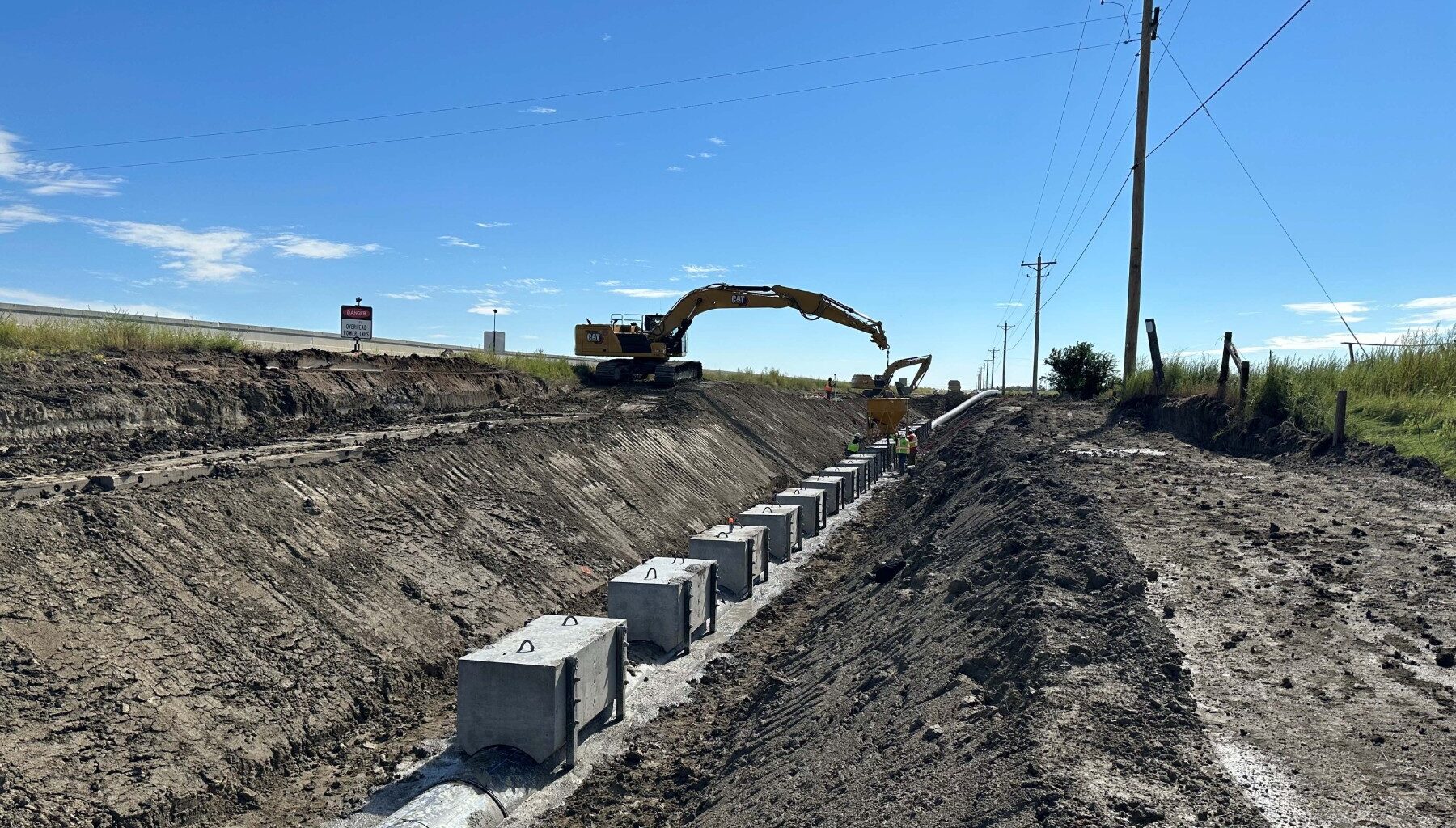 Heavy equipment and new pipeline in ditch