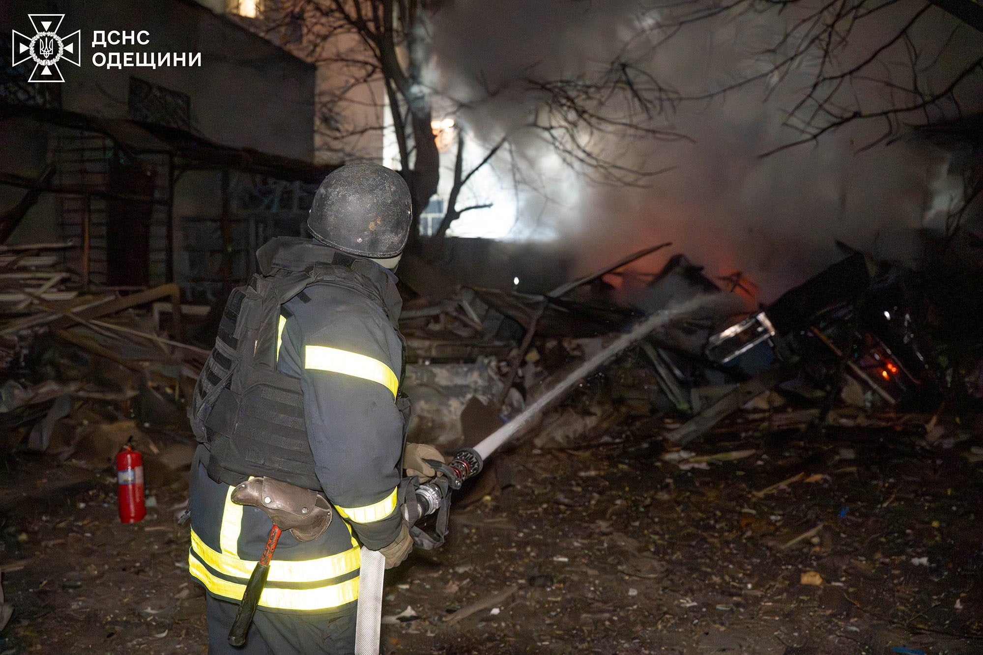 A firefighter works at the site of a Russian drone strike in Odesa amid Russia’s attack on Ukraine
