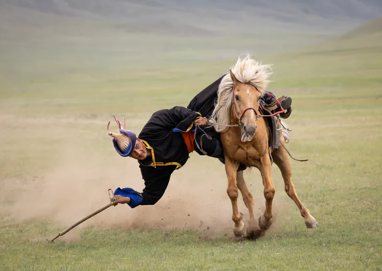 Ann Westling_Mongolian Practice Competition_Grabbing a Riding Crop Off the Ground