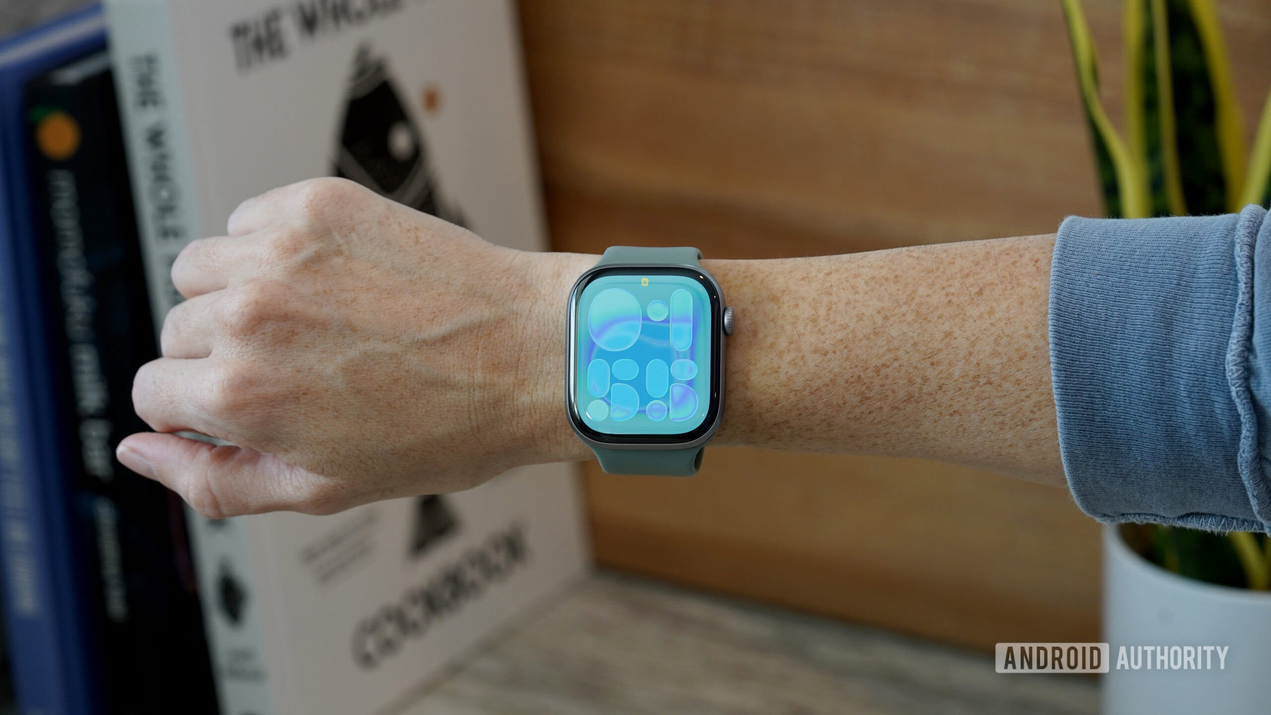 An Apple Watch Series 11 displays the new Flow watch face.