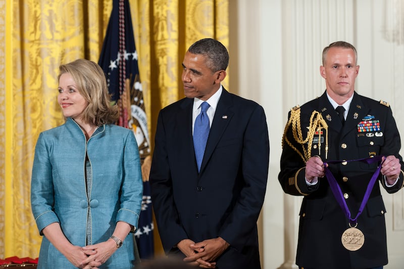Former President Barack Obama presents a 2012 National Medal of Arts to Renee Fleming for her contributions to American music.