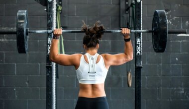 photo of a woman lifting weights at a gym