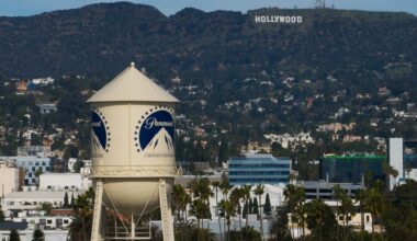 The Paramount Pictures water tower is seen in Los Angeles, Thursday, Dec. 18, 2025, with the Hollywood sign in the distance. (AP Photo/Jae C. Hong)