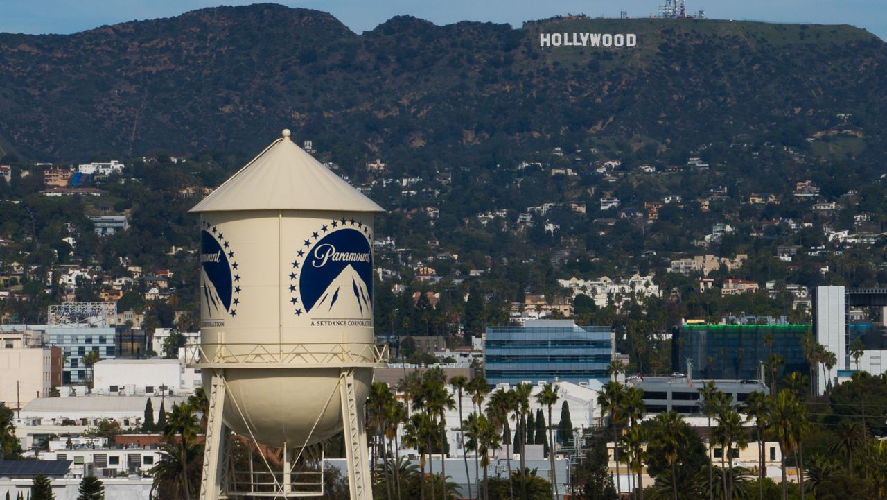 The Paramount Pictures water tower is seen in Los Angeles, Thursday, Dec. 18, 2025, with the Hollywood sign in the distance. (AP Photo/Jae C. Hong)