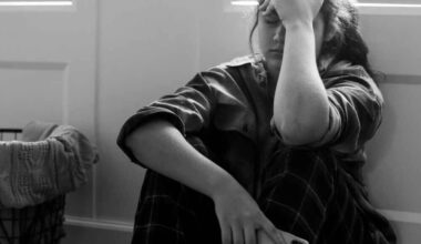 Teen sitting alone with phone, illustrating the dangers of AI mental health support and artificial intelligence influencing vulnerable youth.