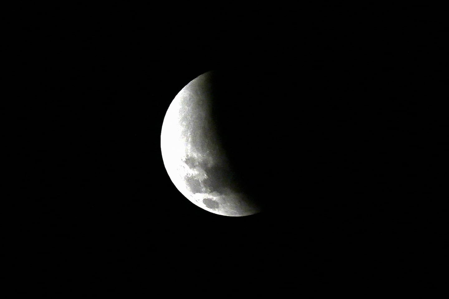 The moon is partly covered in Earth's shadow during a phase of the lunar eclipse on Sept. 8, 2025.