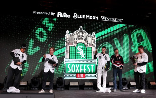 Chicago White Sox players Miguel Vargas, Chase Meidroth, Colson Montgomery, and Kyle Teel, unveil their bobblehead dolls during SoxFest at the Ramova Theatre in Chicago's Bridgeport neighborhood on Friday, Jan. 30, 2026. (Chris Sweda/Chicago Tribune)