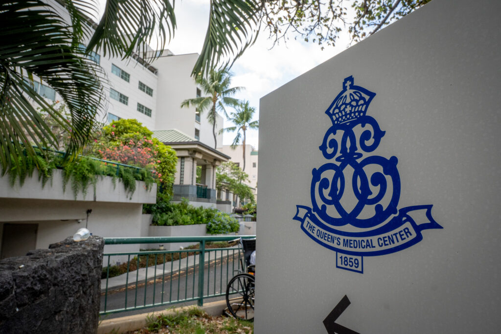 A sign showing the logo of The Queen’s Medical Center in Honolulu, HI, Saturday, Aug. 16, 2025. (Craig Fujii/Civil Beat/2025)