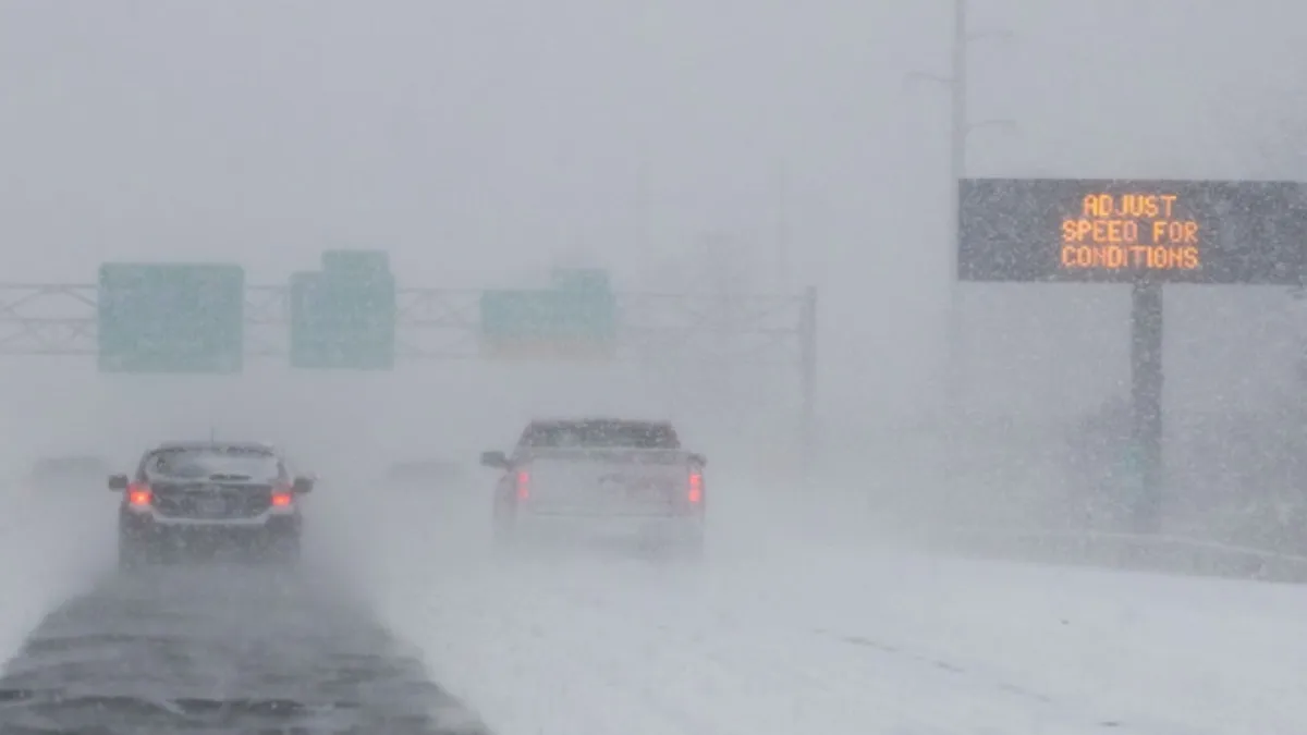 Cars wading thorough a winter storm