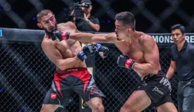 Christian Lee punches Alibeg Rasulov in their World Title fight at ONE 173