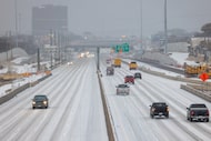 Cars move along icy roads on I-635 near Skillman Street in Dallas on Tuesday, Jan. 31, 2023....